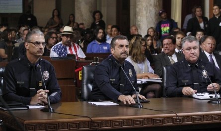 Los Angeles Police Chief Charlie Beck (center) spoke at the City Council meeting about the proposed ban on July 24, 2012