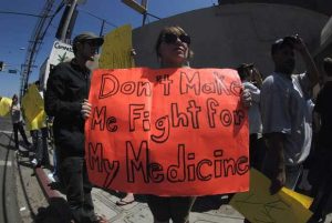 Protestor at DEA raid of medical marijuana dispensary in Hollywood, CA